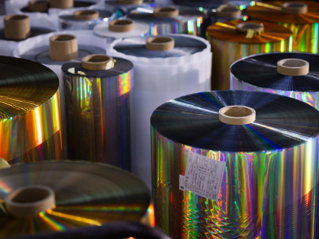 How does holographic foil improve product shelf appeal in retail environments?