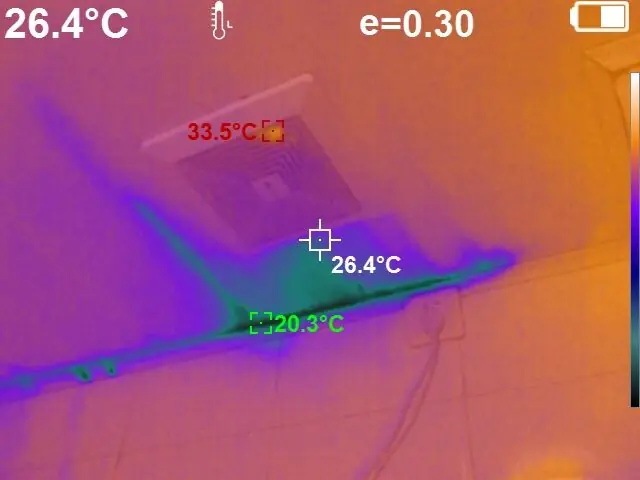 Thermal camera screen capture showing a hidden water leak behind a wall detected by temperature difference, measuring 20.3 to 33.5 degrees Celsius