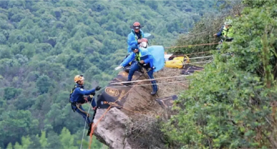 Blue Sky Rescue rescuers performing a cliff rope rescue exercise on a rock face during the Mission of Light 2025 mountain rescue discipline