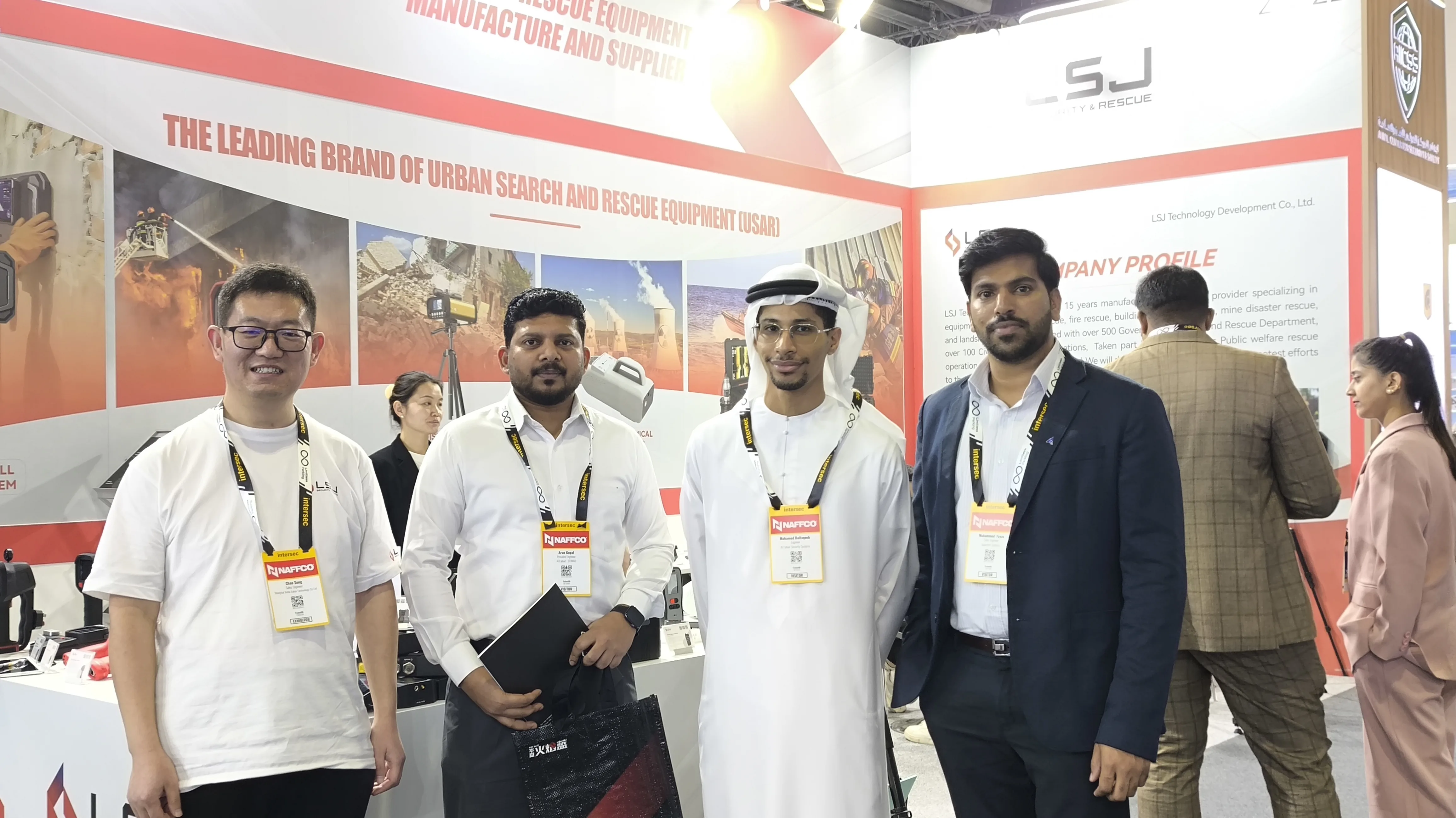 IMG-02 | LSJ Middle East Partners at INTERSEC 2026 LSJ staff meeting Middle East partners and regional agents in front of the LSJ USAR equipment wall at INTERSEC 2026, Dubai World Trade Centre.