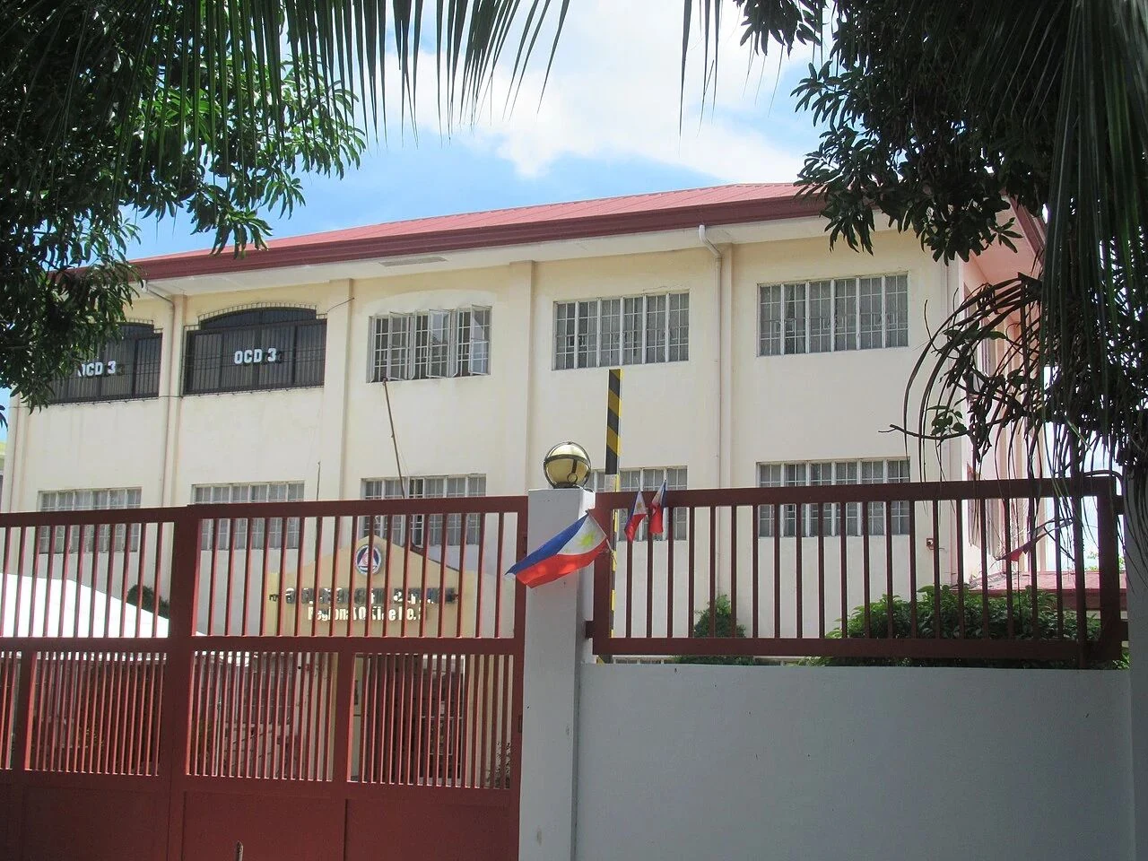 Office of Civil Defense Region 3 headquarters in the Philippines with Philippine flags above the entrance gate