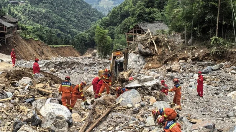 Rescue workers search rubble after the May 2025 Longsheng flash flood and mudslide in Guangxi