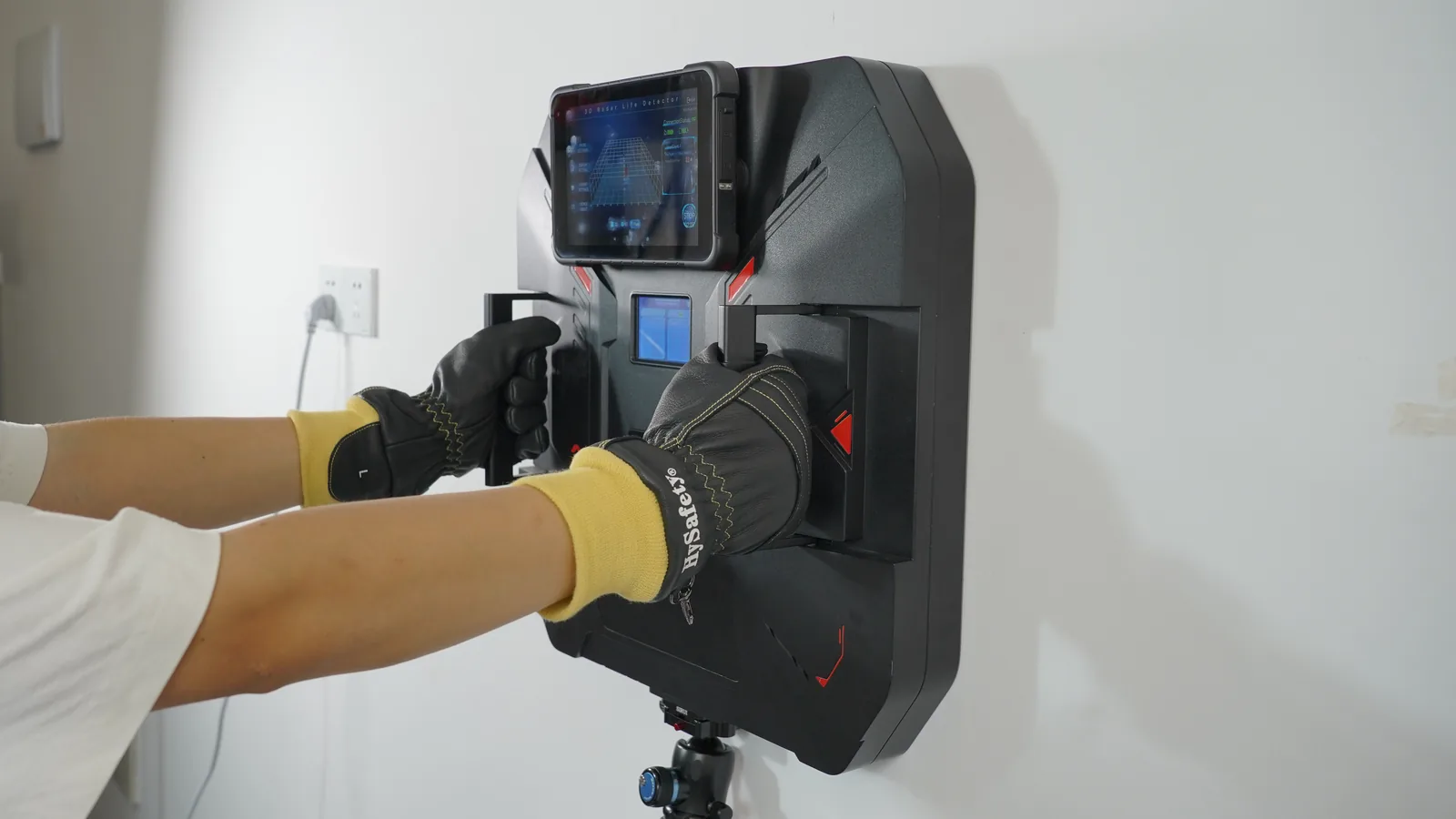 Operator scanning a concrete wall with the LSJ TWR-III, whose 3D interface shows live target count and XYZ coordinates