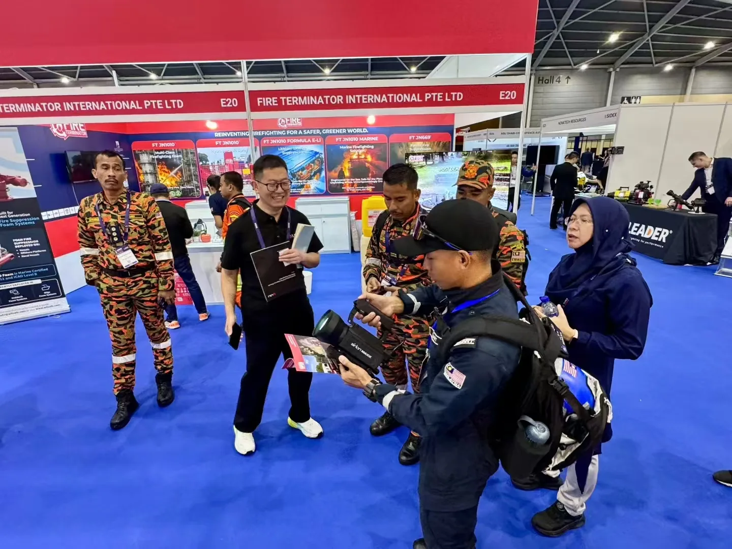 IMG-04 | Live Life Detector Demonstration to Rescue Team LSJ specialist demonstrating a handheld life-detection device to uniformed search and rescue personnel at SIDEX 2025