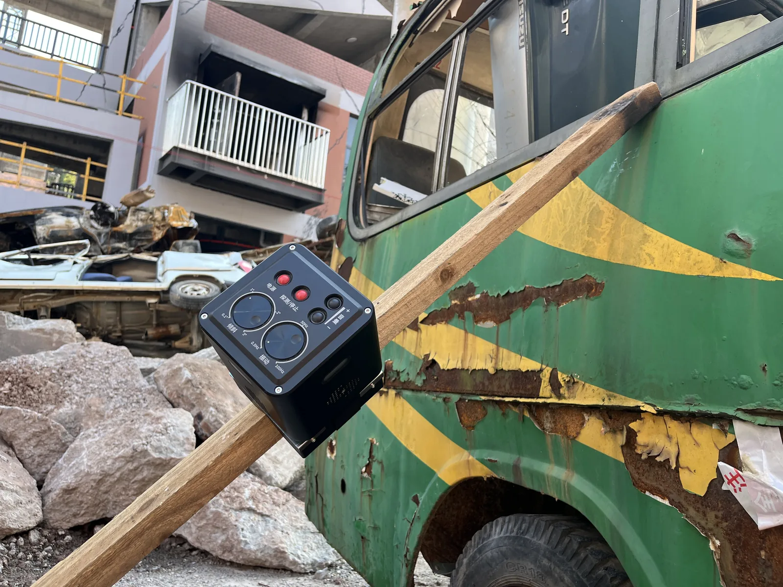LSJ LS-D01 mounted on timber shoring beside a crushed bus during urban search and rescue collapse training