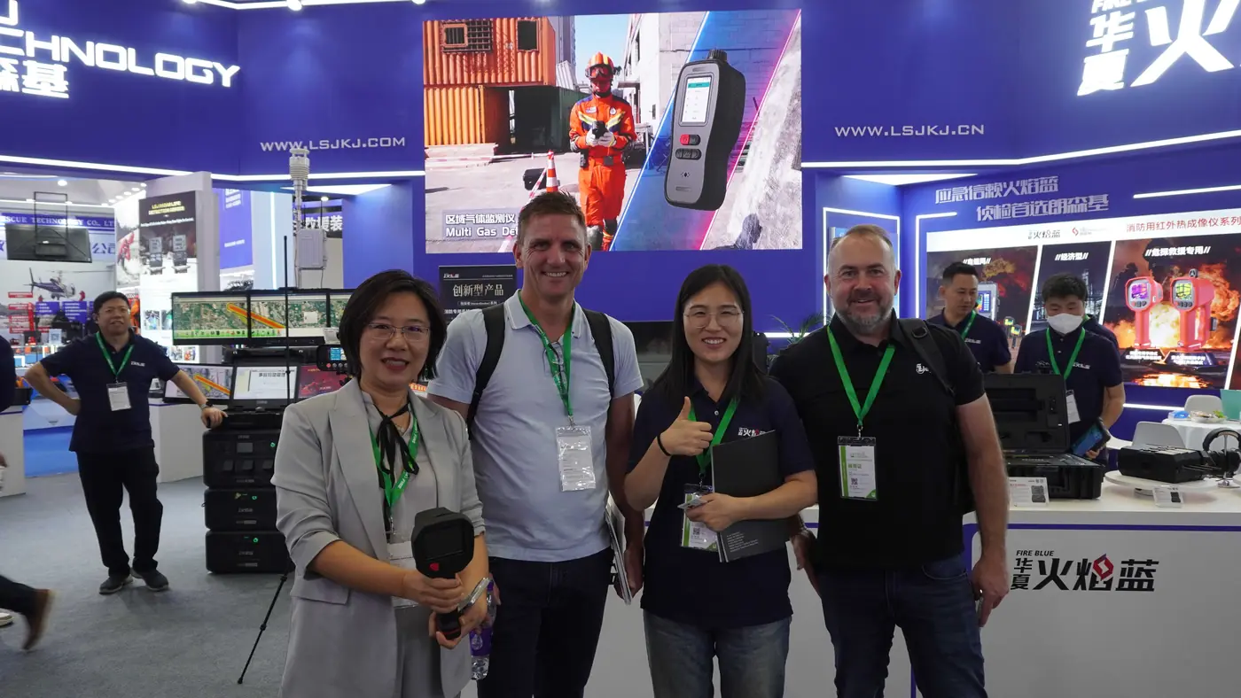 IMG-04 | International Partners at LSJ Booth International partners posing with LSJ team members at the LSJ booth after signing discussions at the Beijing fire exhibition