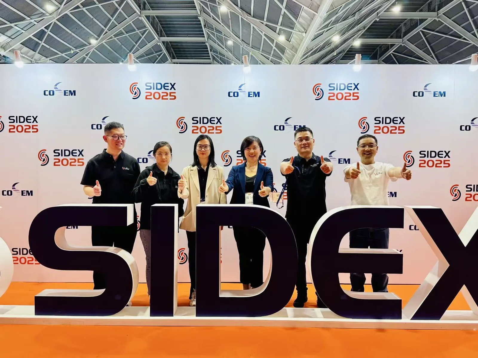 IMG-01 | LSJ Team at SIDEX 2025 Singapore Booth LSJ team posing at SIDEX 2025 in front of the official SIDEX backdrop at Singapore Expo Hall 3