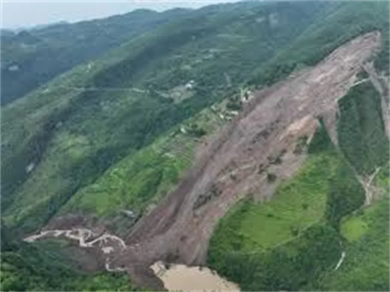 Aerial view of large landslide scars on forested mountain slopes in Guangxi