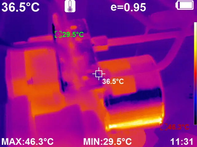 Thermal image of industrial machinery showing overheating components at 46.3 degrees Celsius maximum, used for car and electrical maintenance inspection