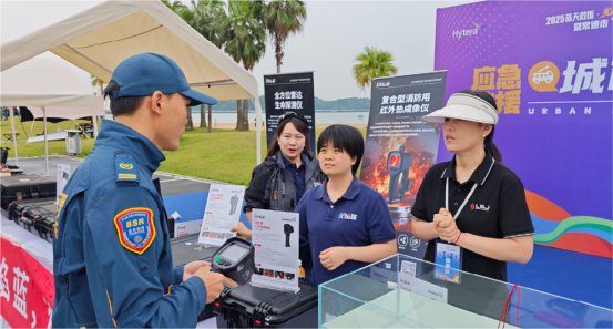 LSJ F1200 firefighting thermal imaging camera being demonstrated to Blue Sky Rescue responders at the LSJ booth