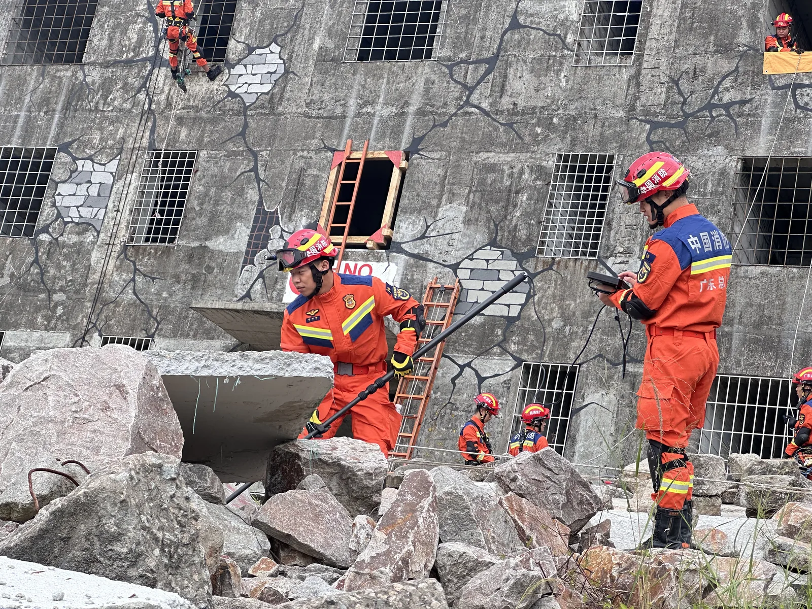 Urban search and rescue team using the LSJ-C-E pole audio video life detector during a building-collapse search drill