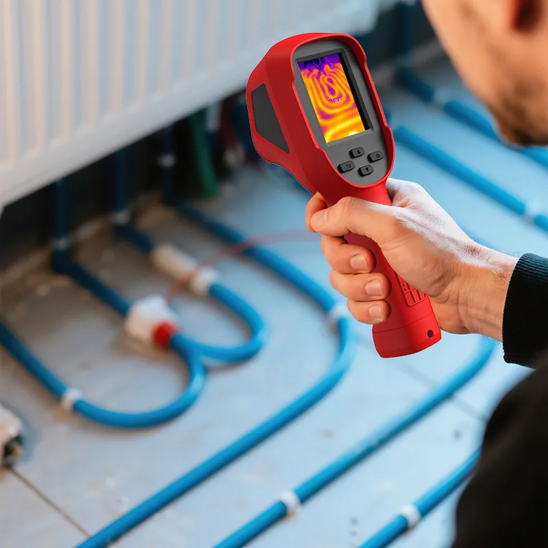 Technician using the LSJ E310 Plus to inspect underfloor heating pipes and plumbing for hidden water leaks