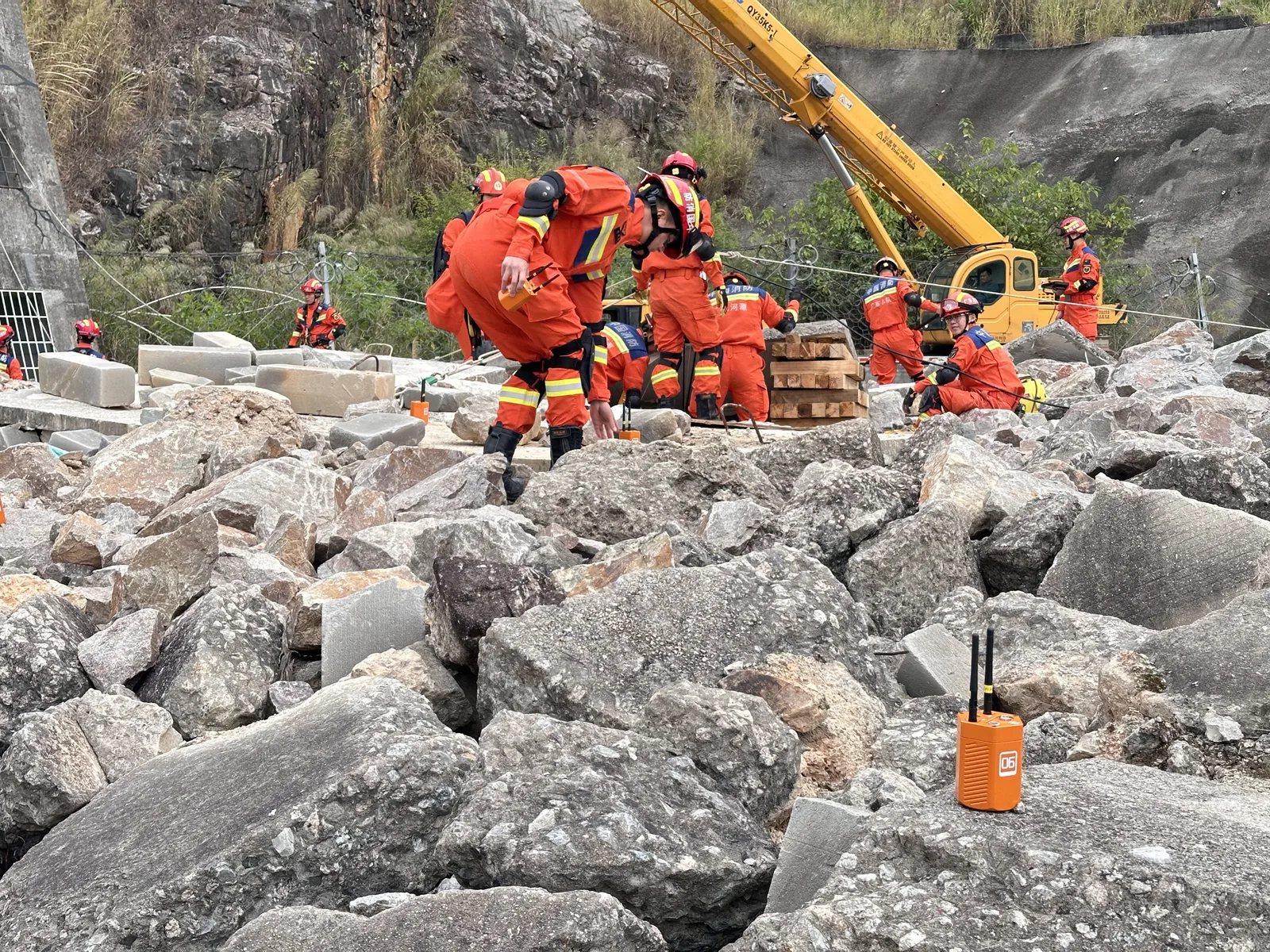 Fire rescue team deploying LSJ wireless microseismic sensors during collapsed structure training
