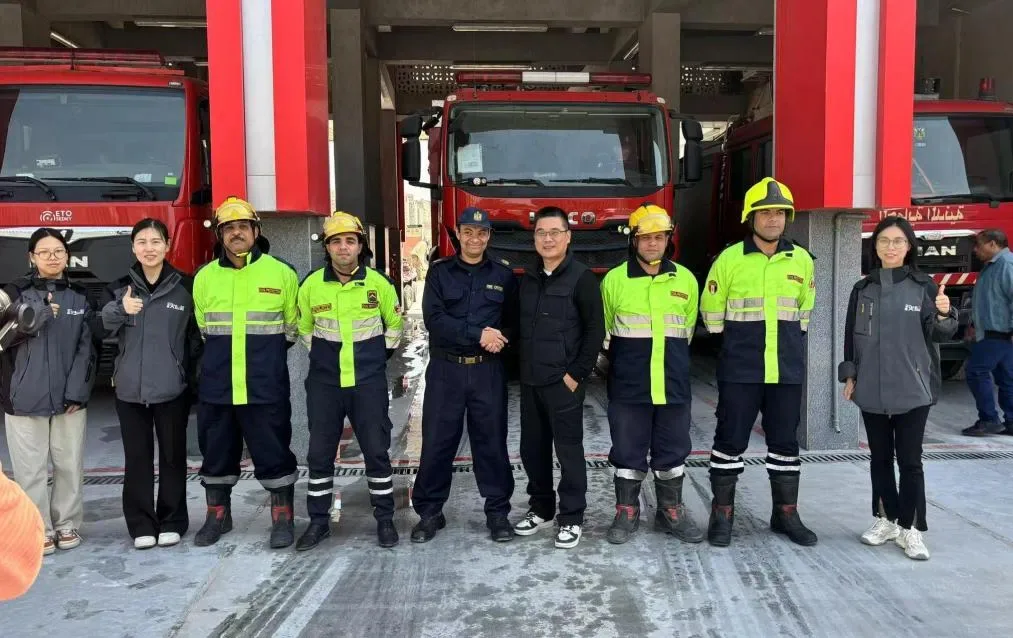 LSJ Engineers and Cairo Civil Defense Firefighters After Equipment Training LSJ Technology engineers pose with Cairo Civil Defense firefighters in front of fire engines after rescue equipment delivery and hands-on training at the Cairo fire station