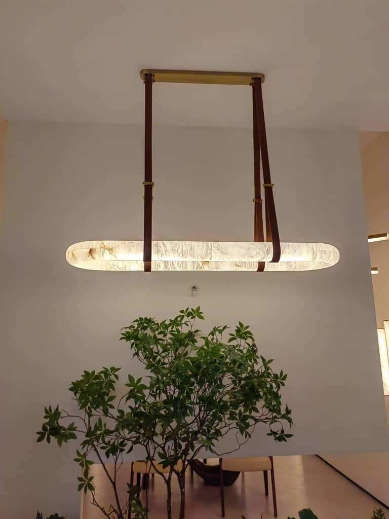 Insert image NHB Lighting showroom interior, alabaster chandelier and greenery décor.png