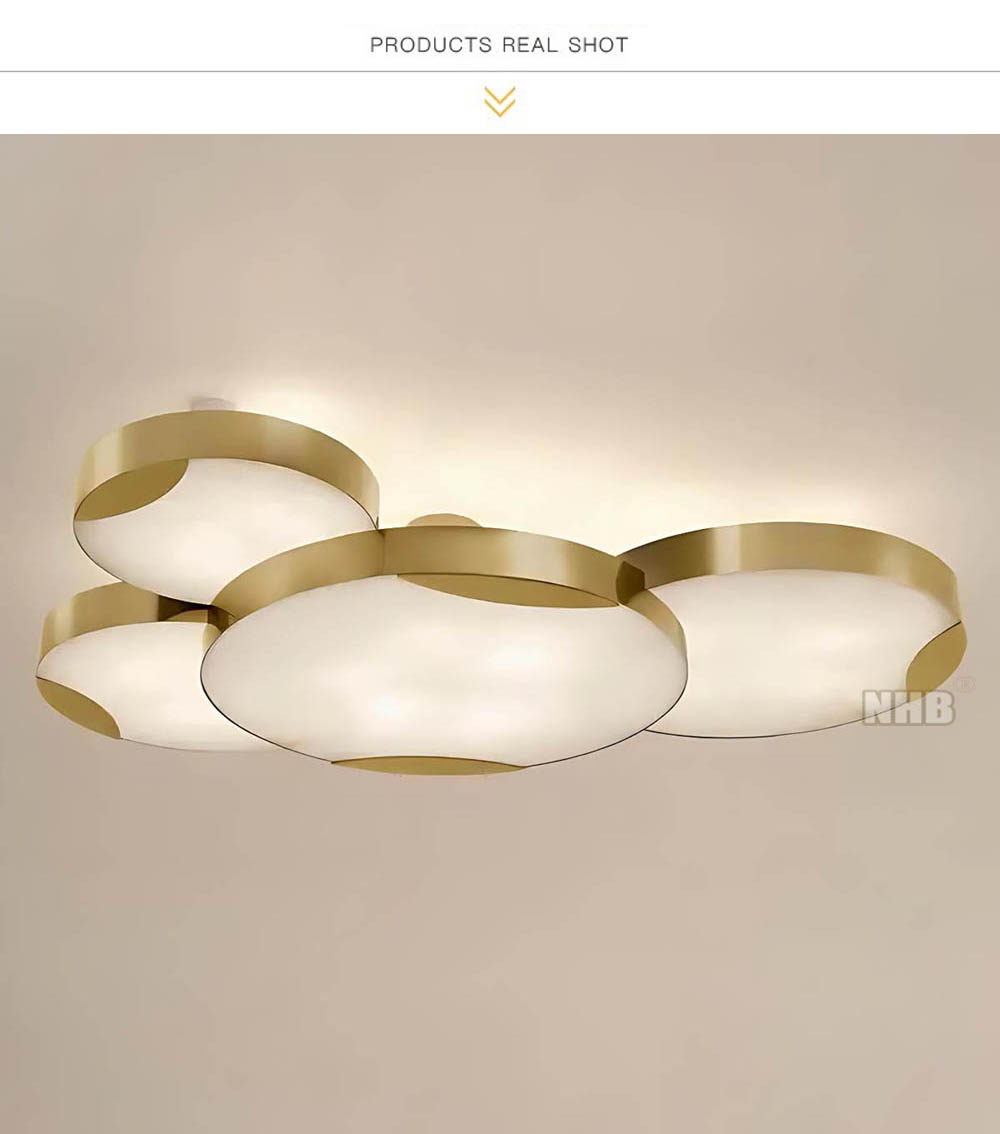 1.modern-brass-alabaster-ceiling-light-lit.jpeg