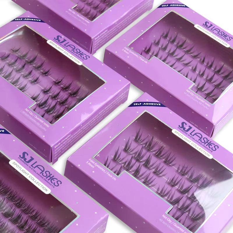 Fanned-out purple self-adhesive lash boxes showing clear windows, corner self-adhesive banners and 5-row lash cluster trays - custom window lash box OEM