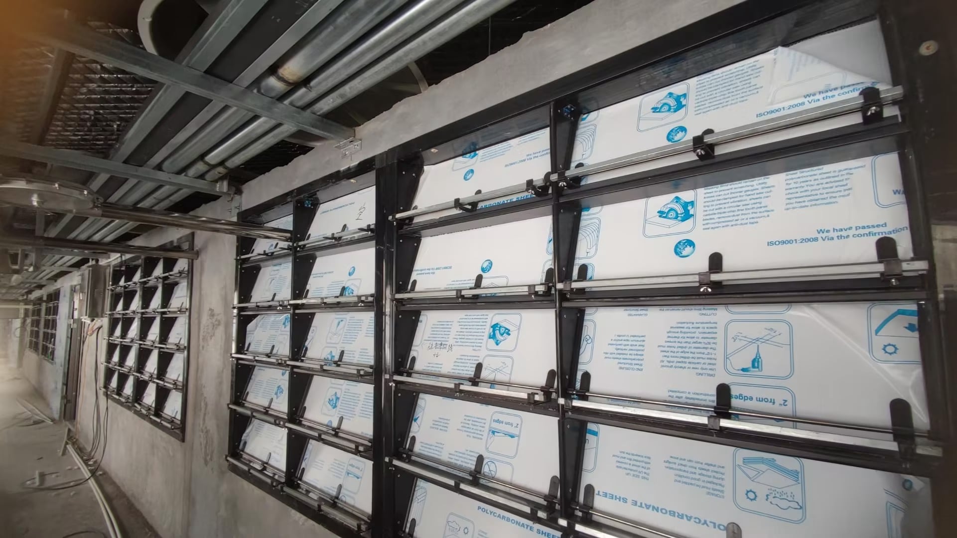 Sidewall panel system installed in the pig house