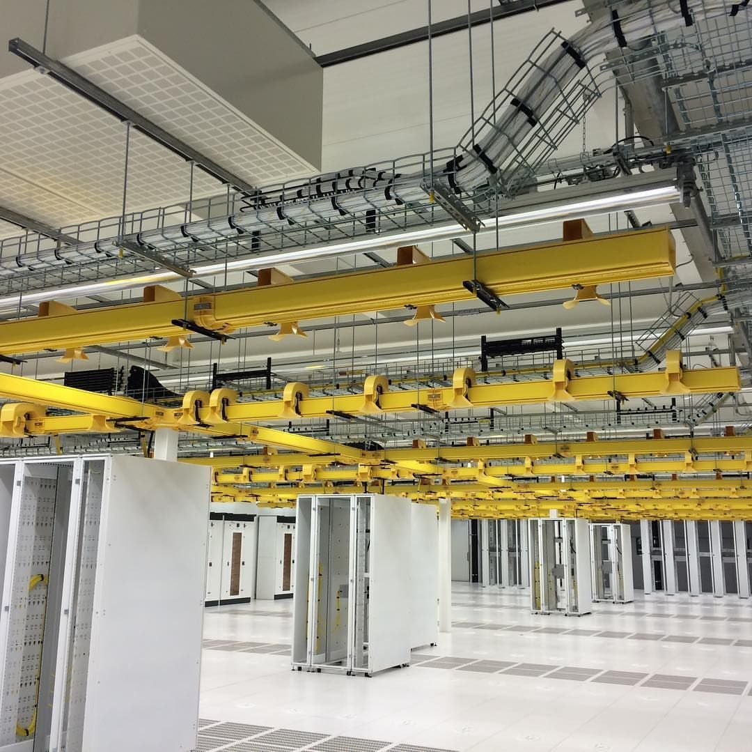 The yellow fiber troughs and wire wesh cable tray used in American data centers.jpg