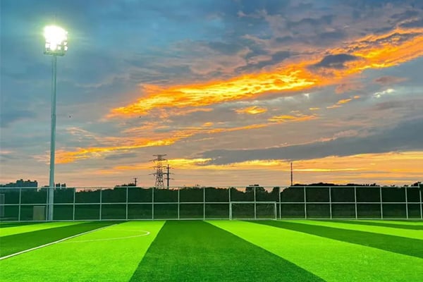 What are the service lives of football fields with different configurations