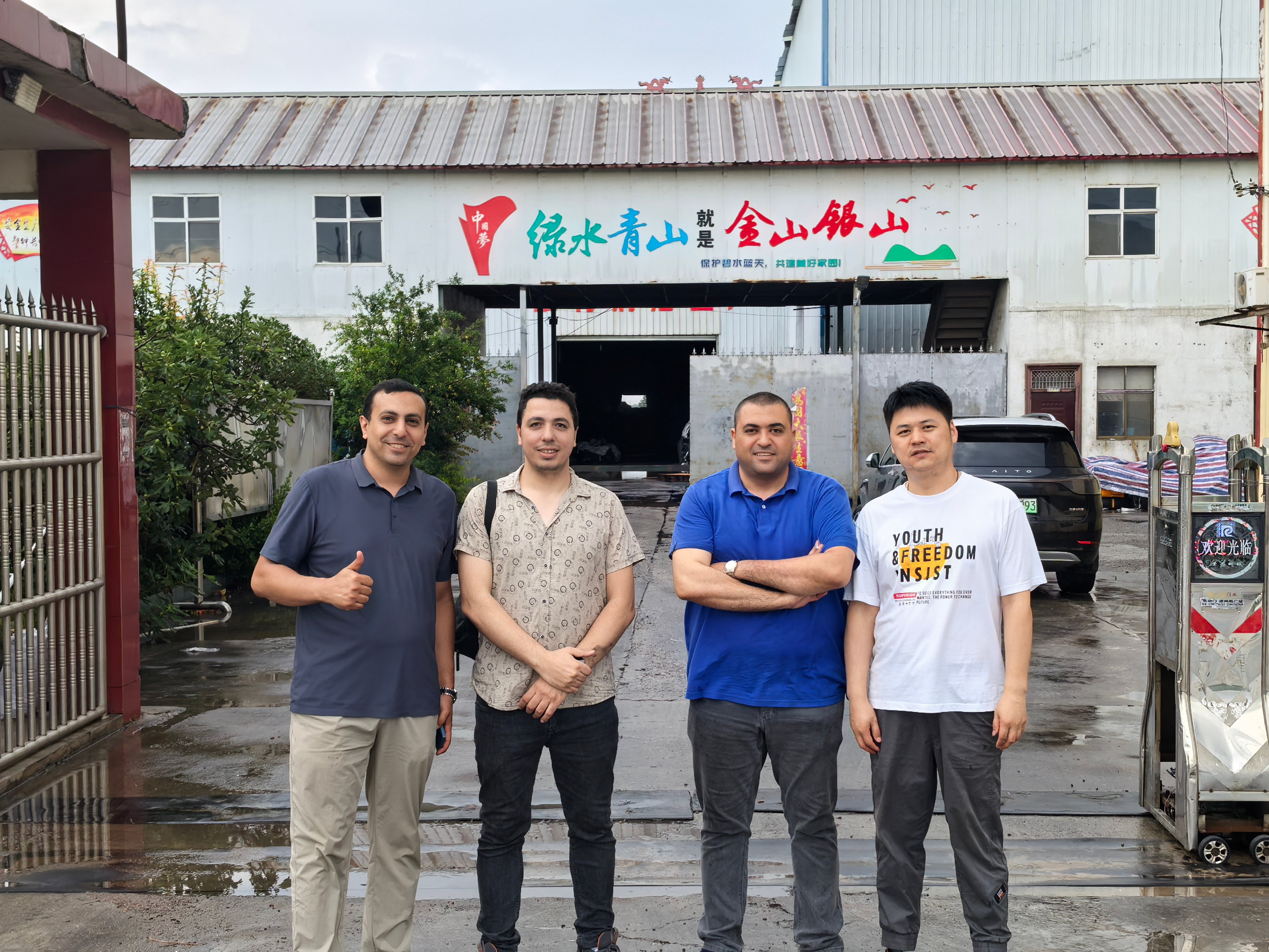 photo with the customer who purchased the activated carbon made from almond shells.