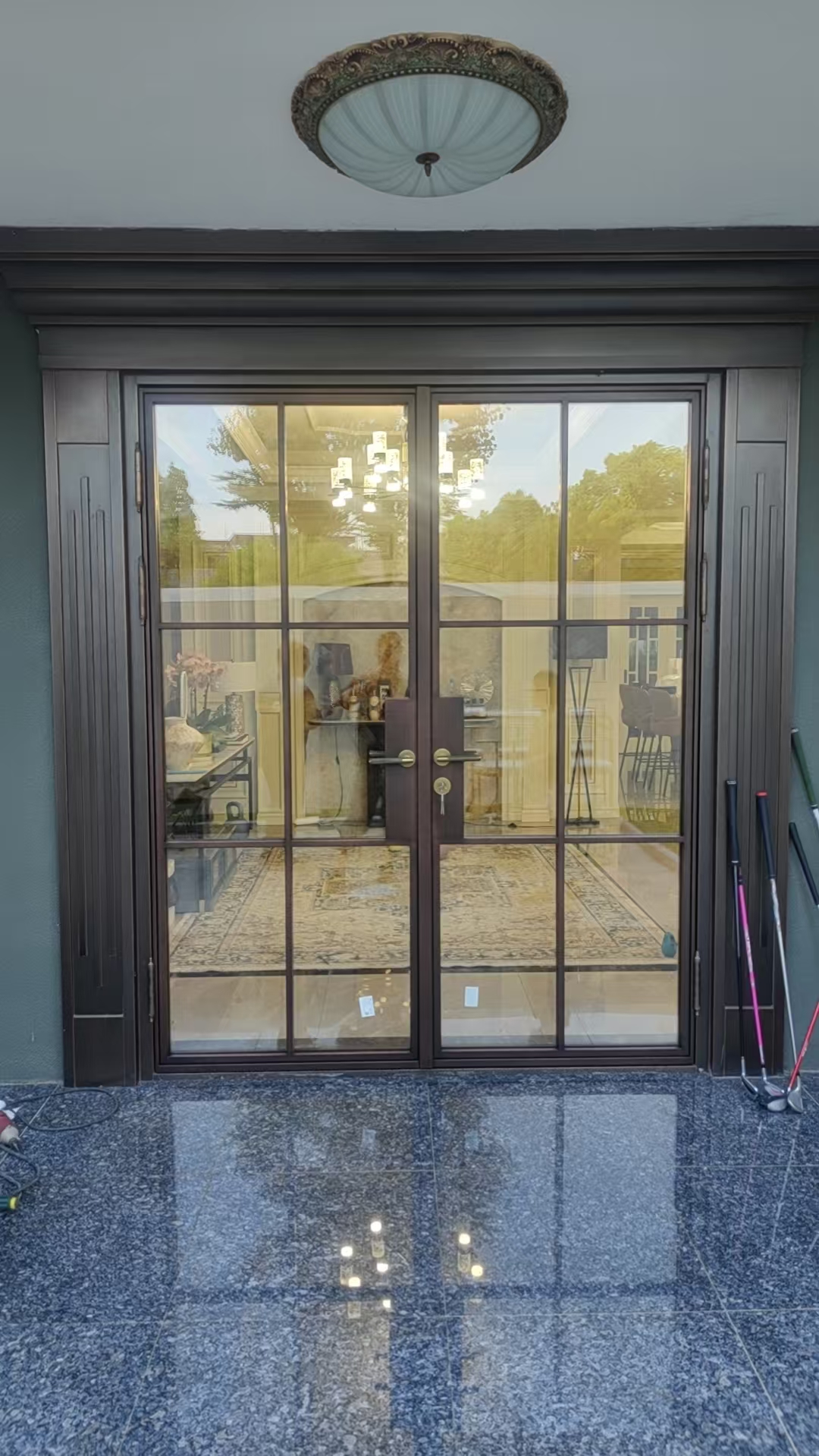 Why specify brass and bronze doors for high-end hotel entrances? 