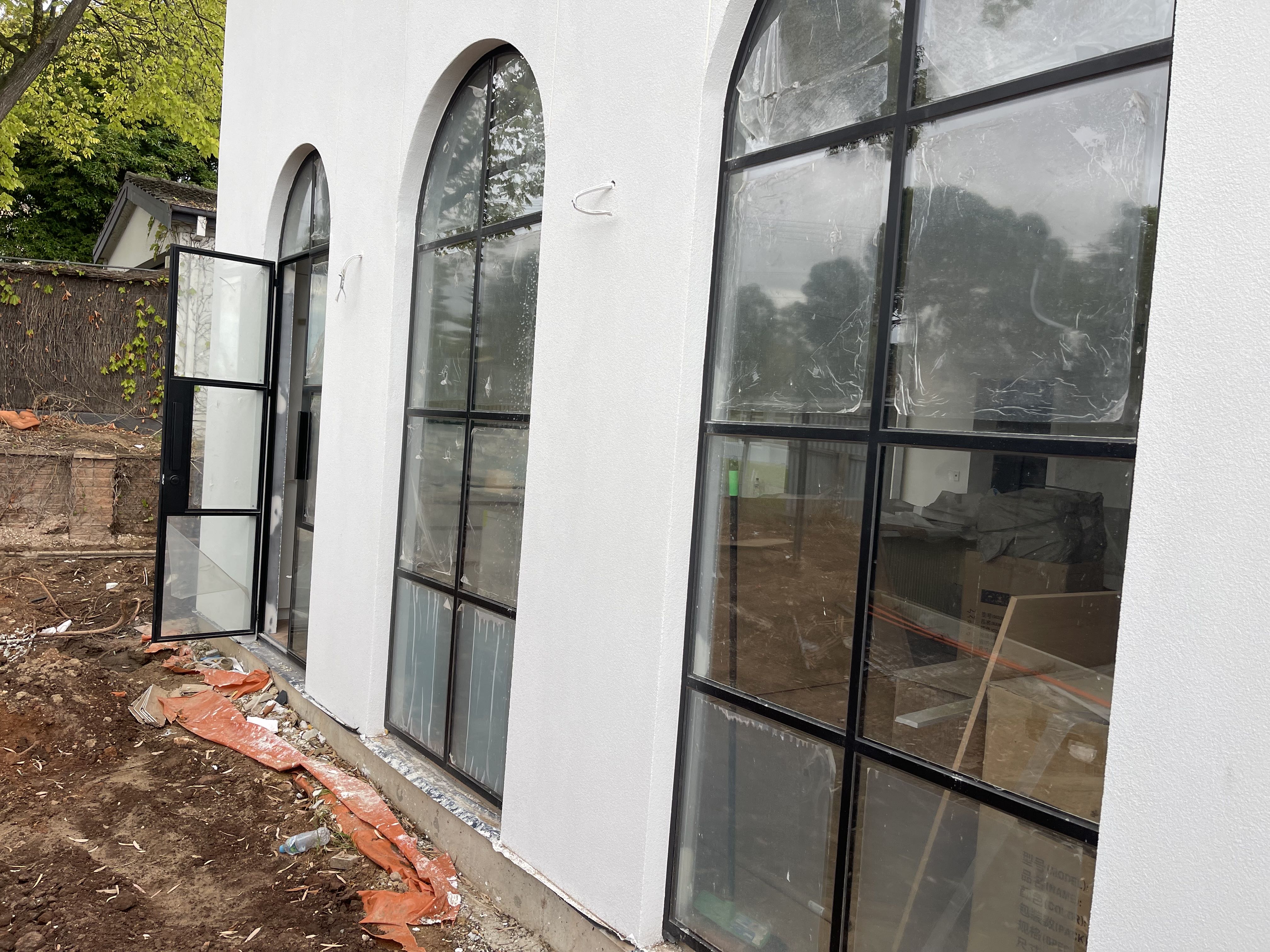 Why steel arch doors add a timeless European elegance to your facade.
