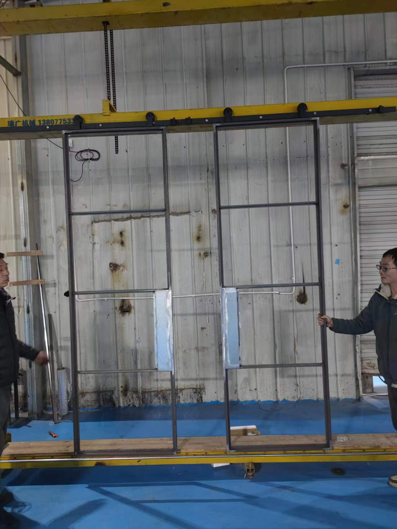 Can a steel barn door solve space-saving issues in industrial-style homes?