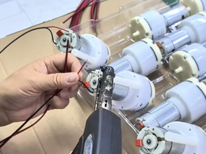Massage Mattress Motor Core Assembly — Real Factory Footage Shows Hand-Built Units with Protective Silicone