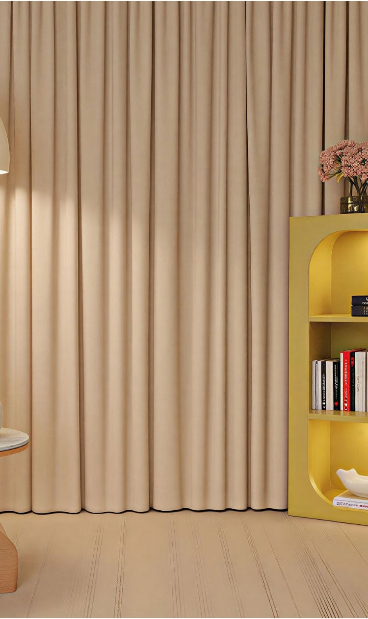 Beige curtains in a styled room, showing smooth drape and a warm, soft-focus visual effect.