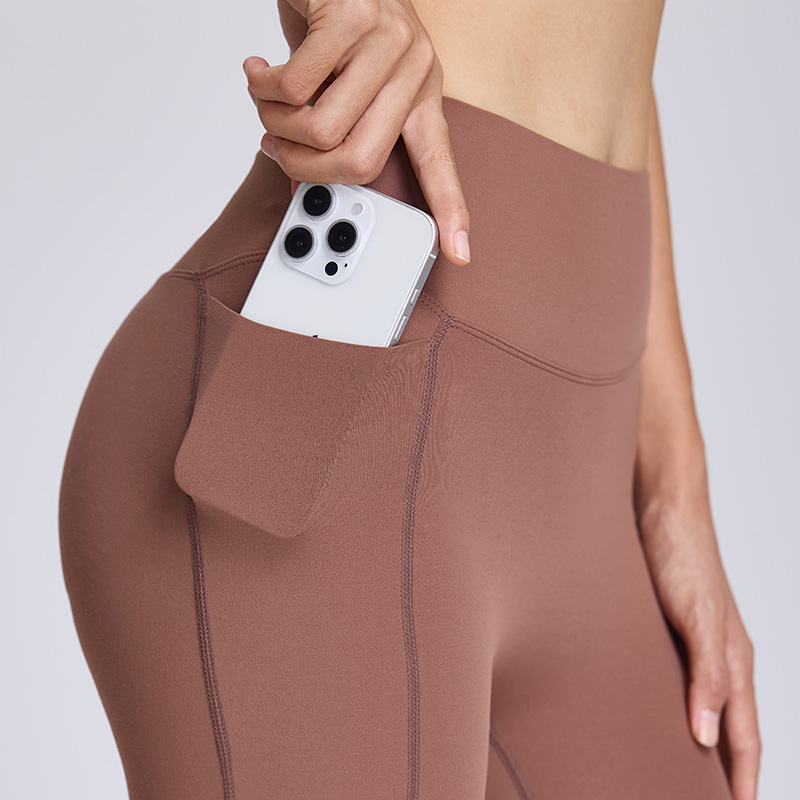 Short da palestra e yoga traspiranti con vita alta e controllo addominale, dotati di tasche laterali