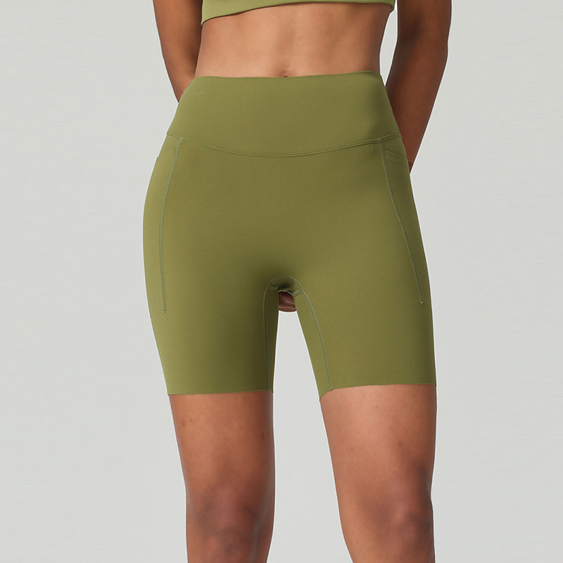 Short da palestra e yoga traspiranti con vita alta e controllo addominale, dotati di tasche laterali
