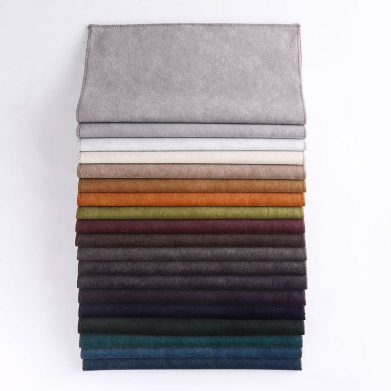 Unwind and relax on a plush brown sofa fabric.