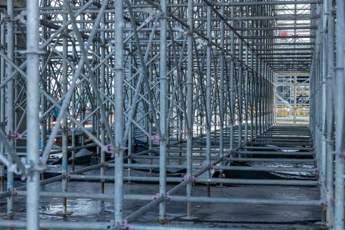 What are the differences between walk-through and climb-through frame scaffolding designs?