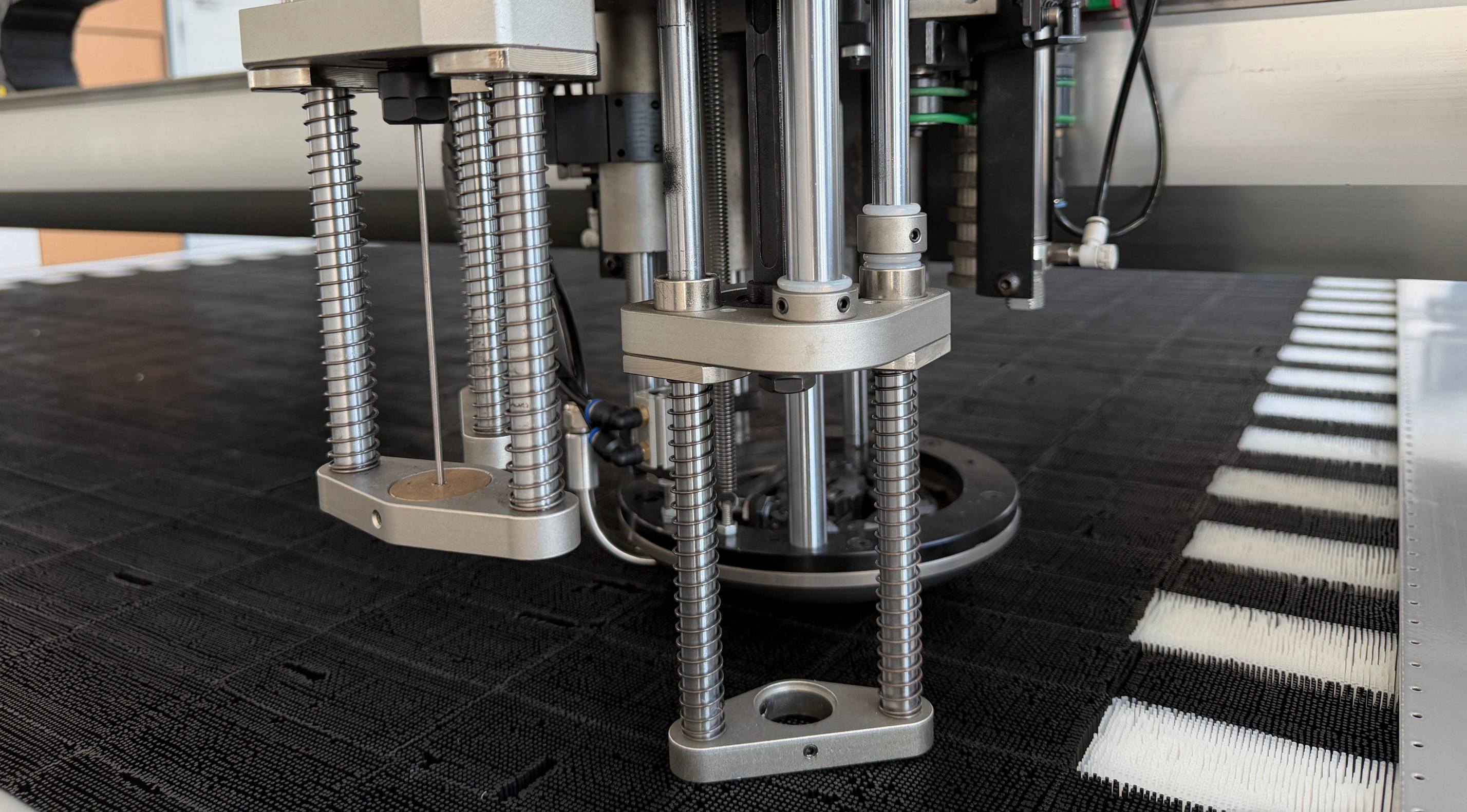 Multi-size punching system with adjustable drill configurations