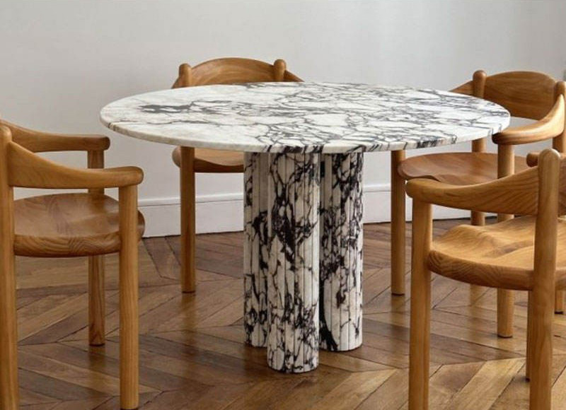 Round natural marble dining table for 4 in luxury villa restaurant