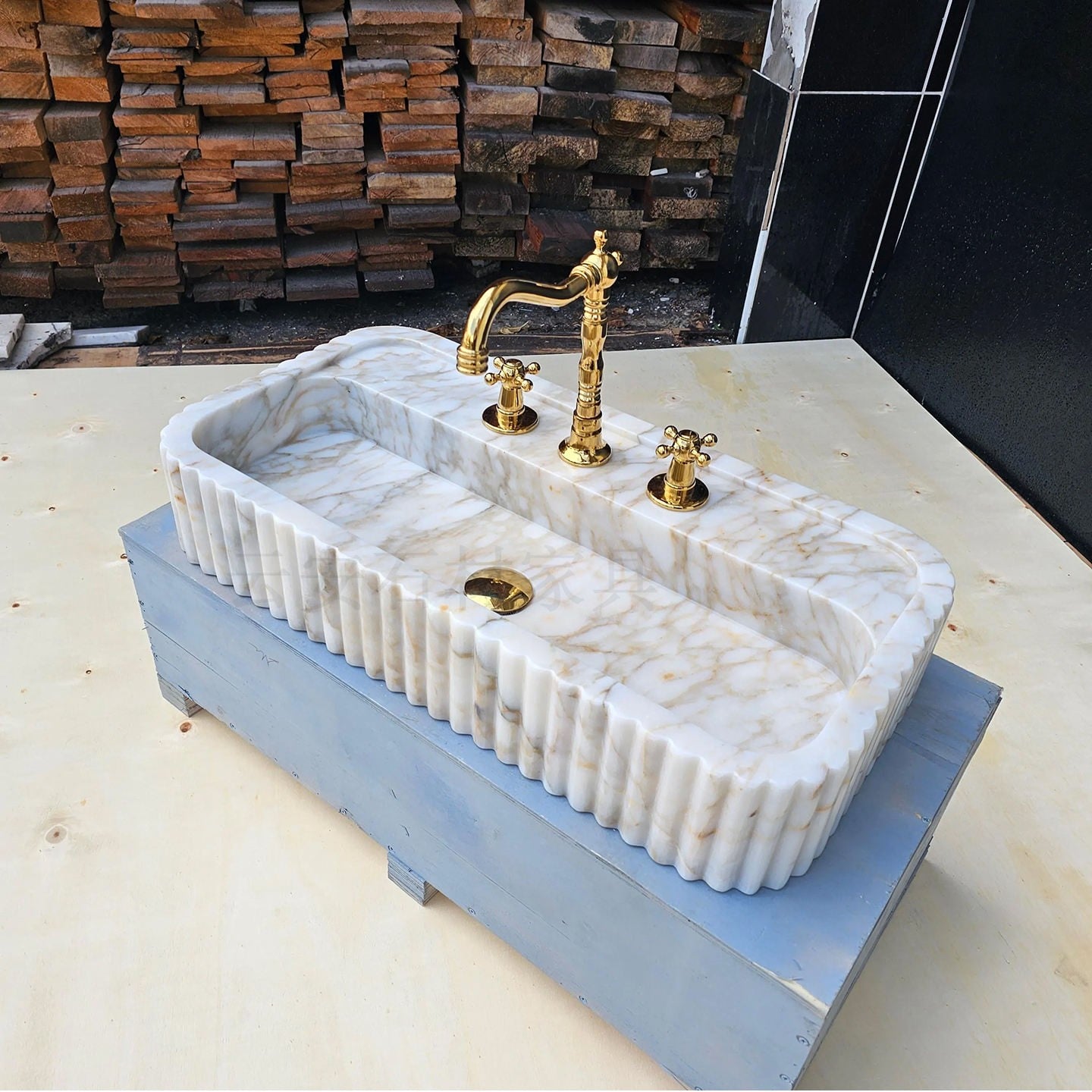Fluted wall mounted marble sink with integrated basin