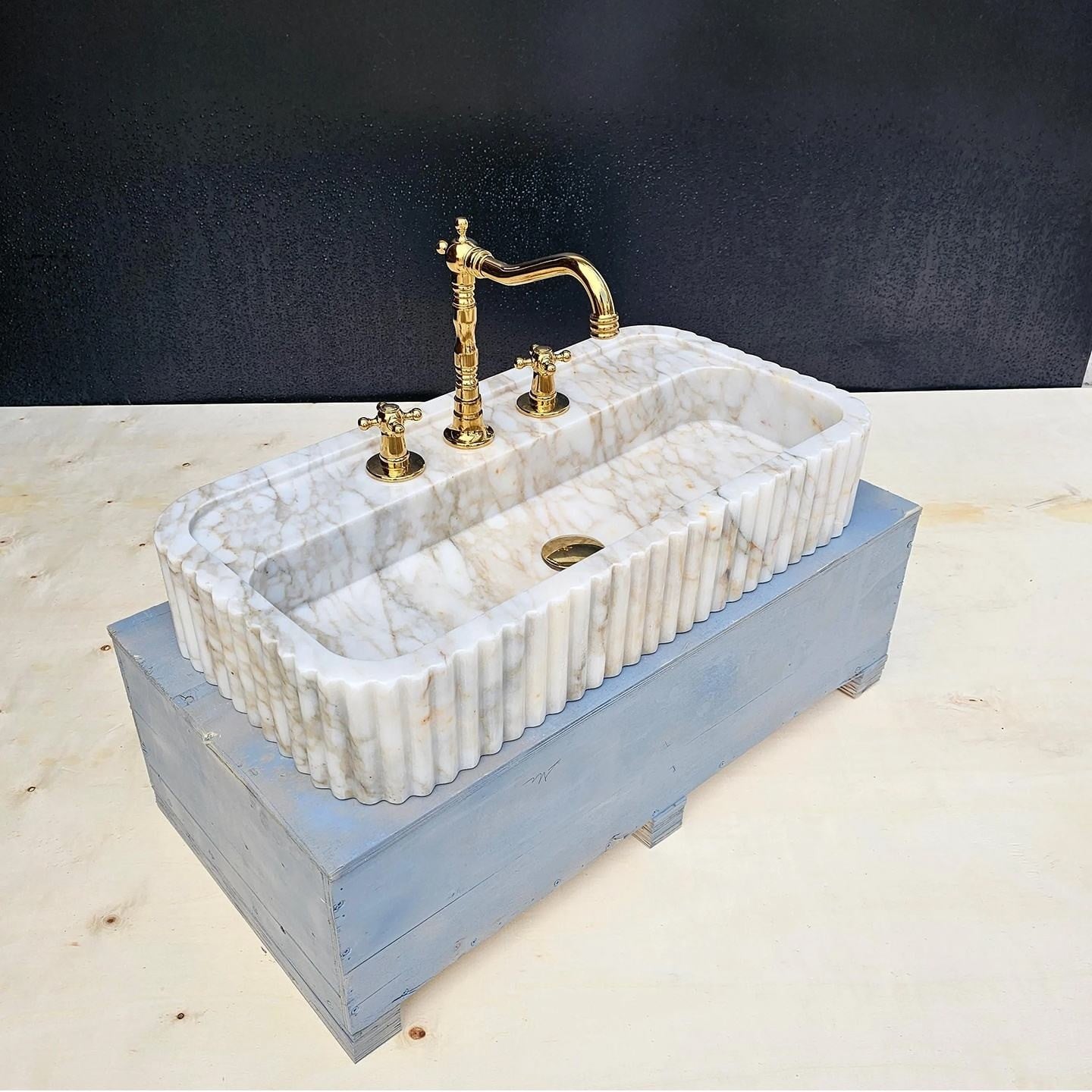 Marble wall mount sink for boutique hotel bathroom