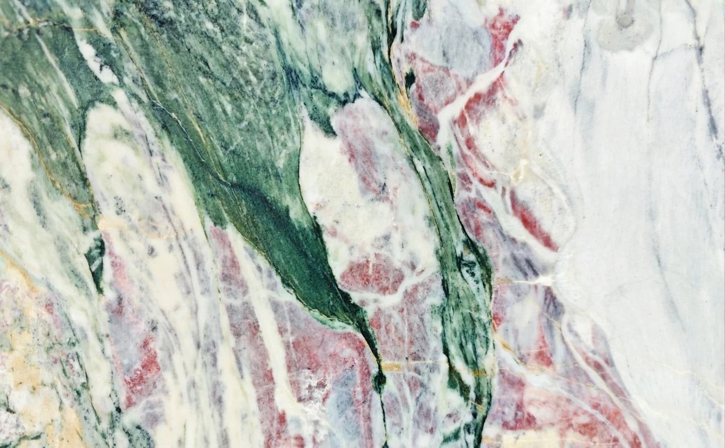 Four Seasons Green Marble slab with deep forest green base and natural white pink brown veining