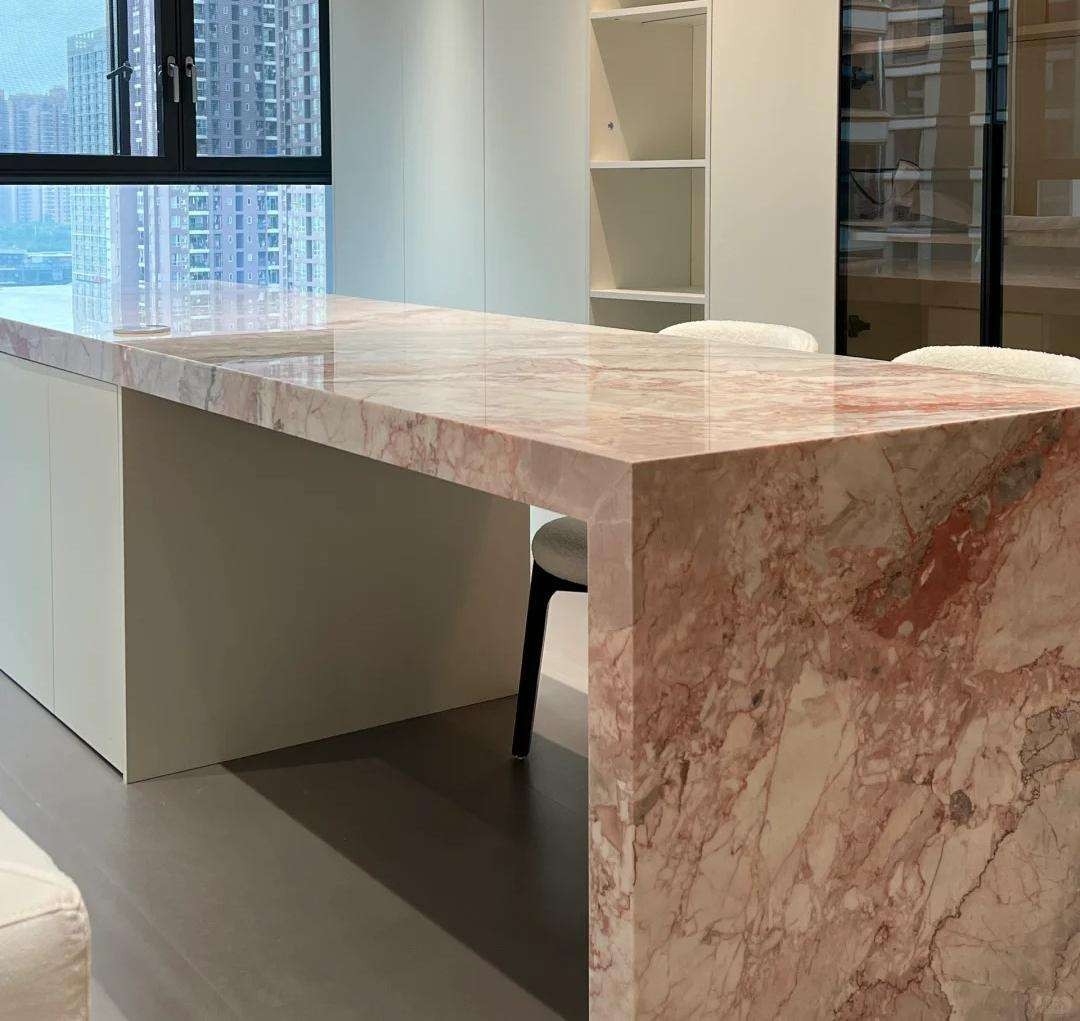 Hot pink Four Season marble kitchen island with red green veining