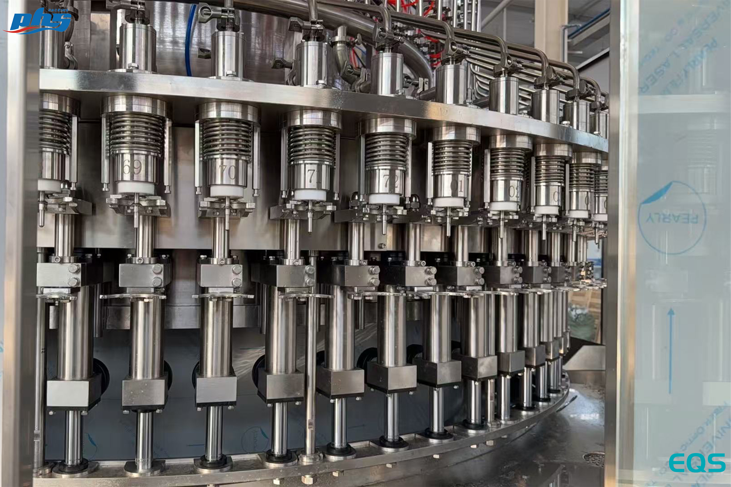 Close view of filling components on the EQS 36,000 BPH mineral water filling machine.jpg