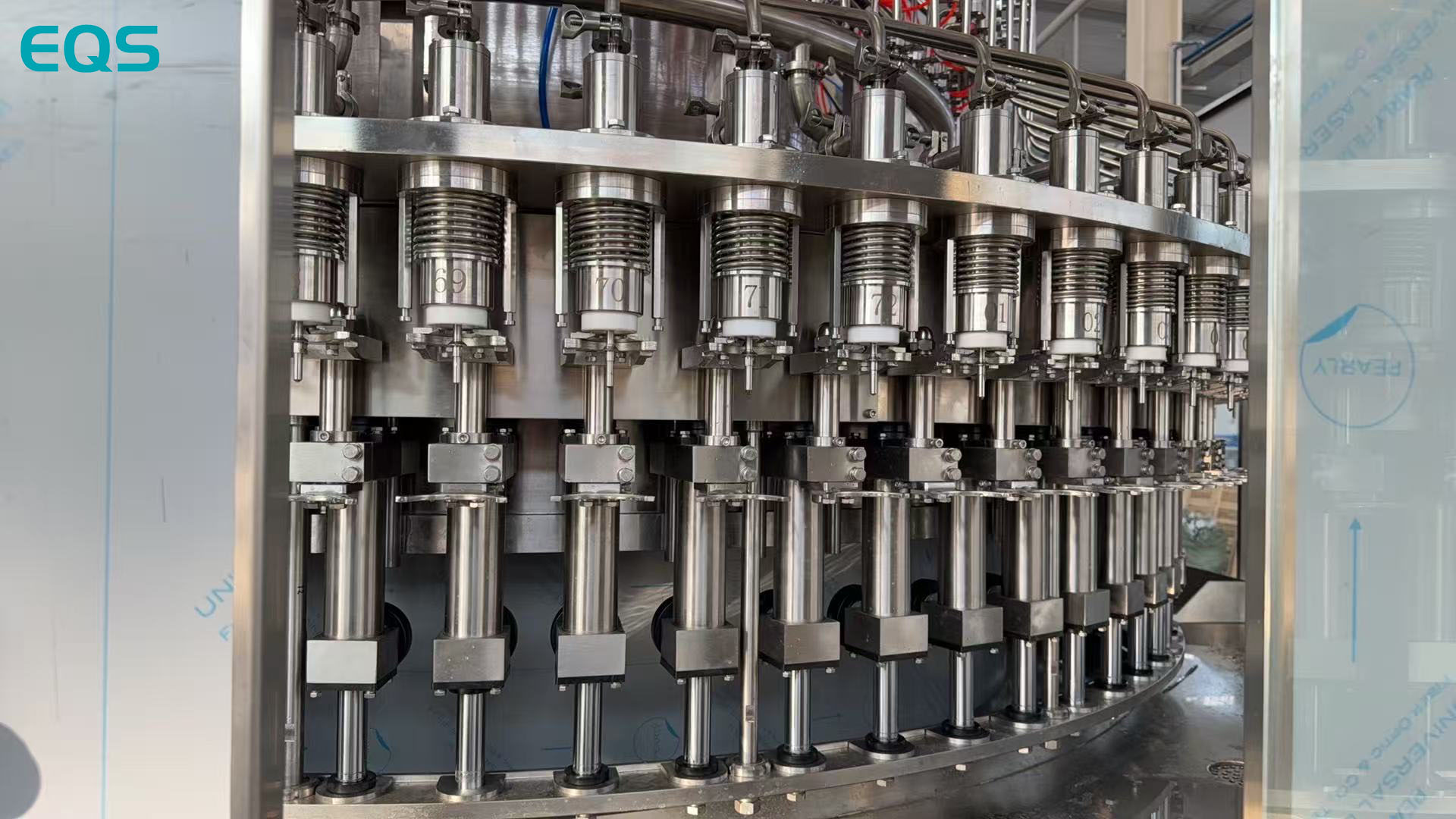Filling valves on the EQS water filling machine for project XGF72-72-20 running 500 ml plastic bottles.jpg