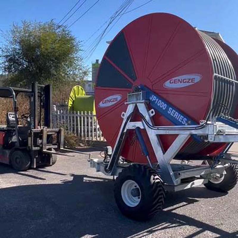 Take the hassle out of watering with a traveling hose reel sprinkler system
