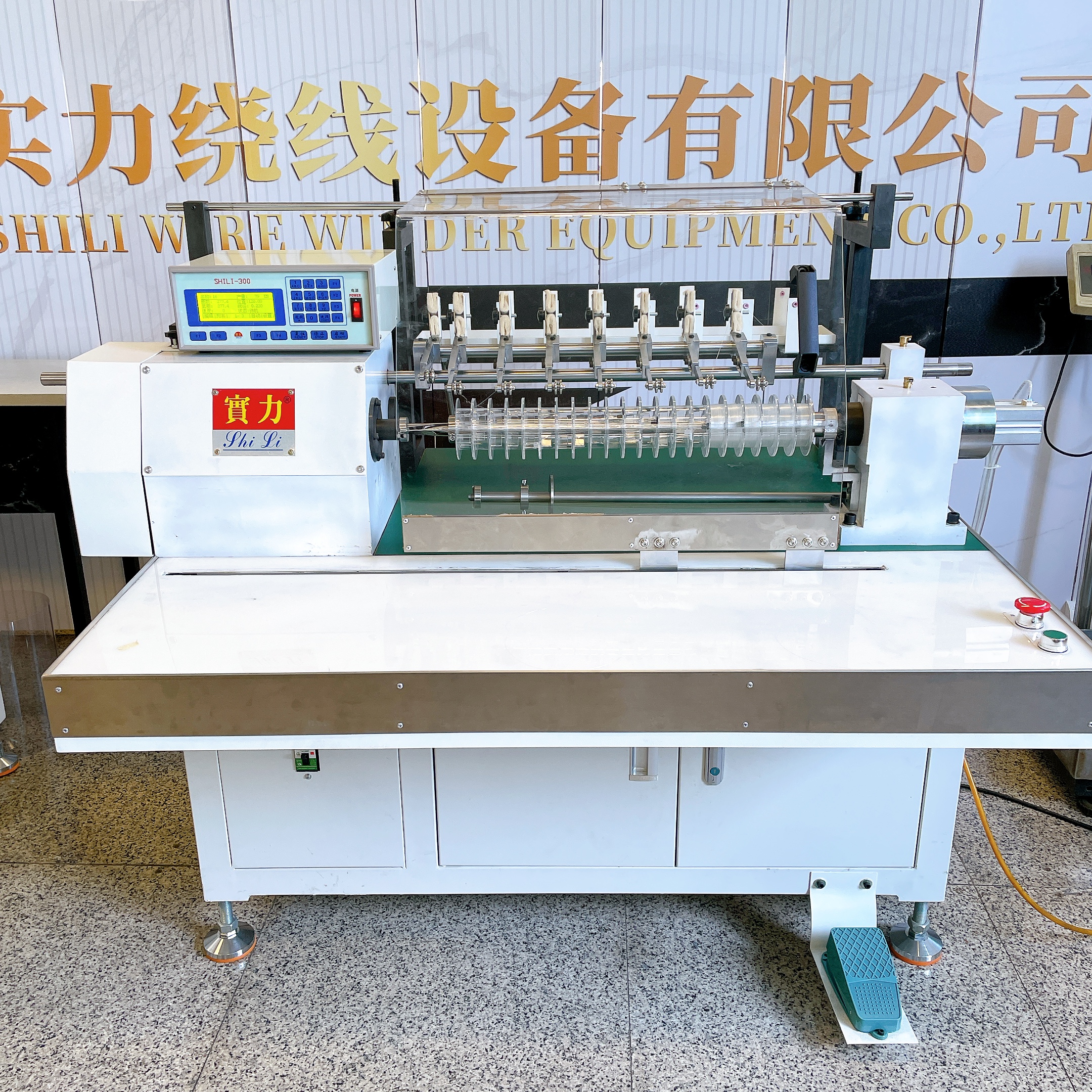 Which Feeding System Reduces Friction in a Fishing Line Winding Machine?