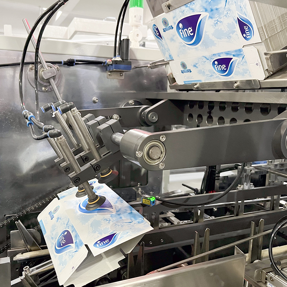 How does a cartoning machine for production line synchronization prevent backpressure jams?