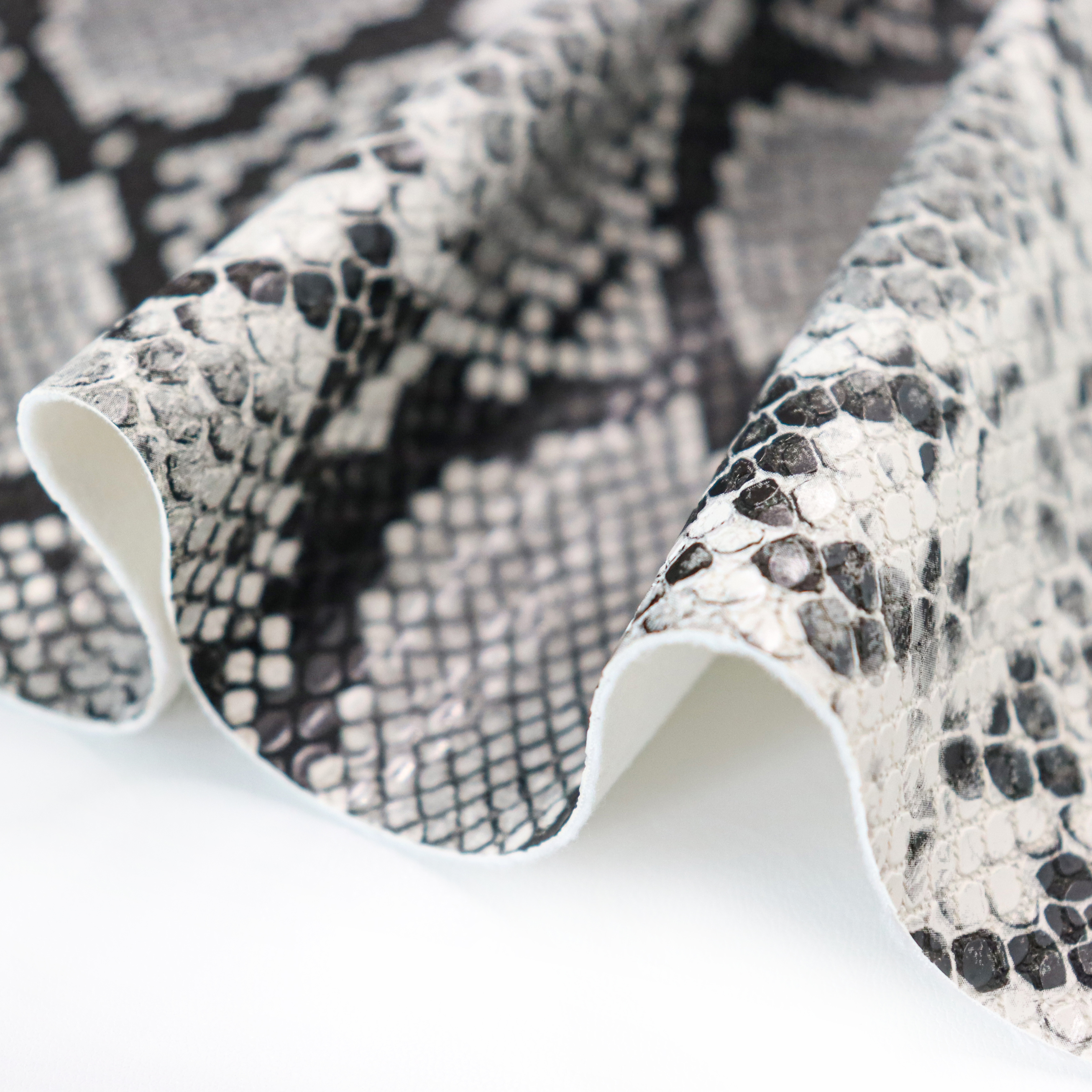 Premium Glossy PU Leather with Customizable Snake Skin and Animal Patterns for Clothing and Handbags supplier