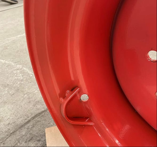 Skid Loader Wheels - Valve Hole Guard