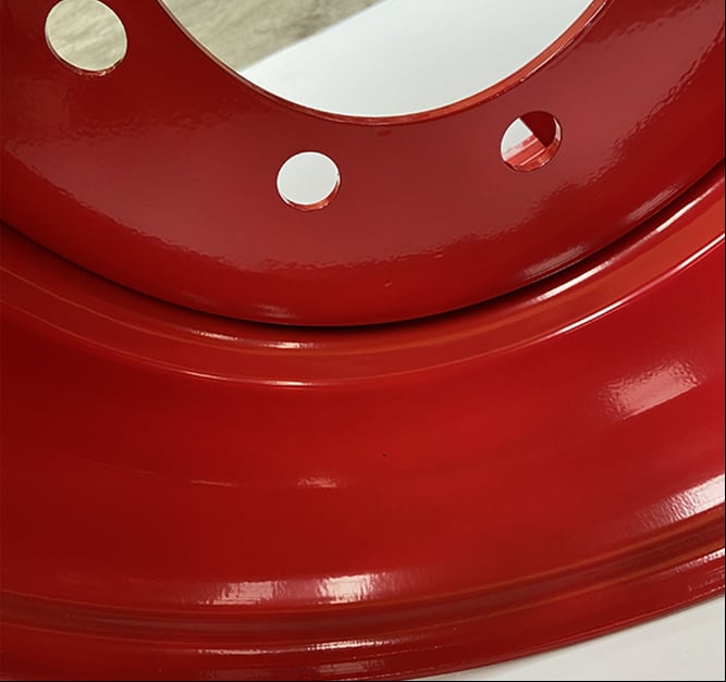 Skid Loader Wheels - Valve Hole Guard