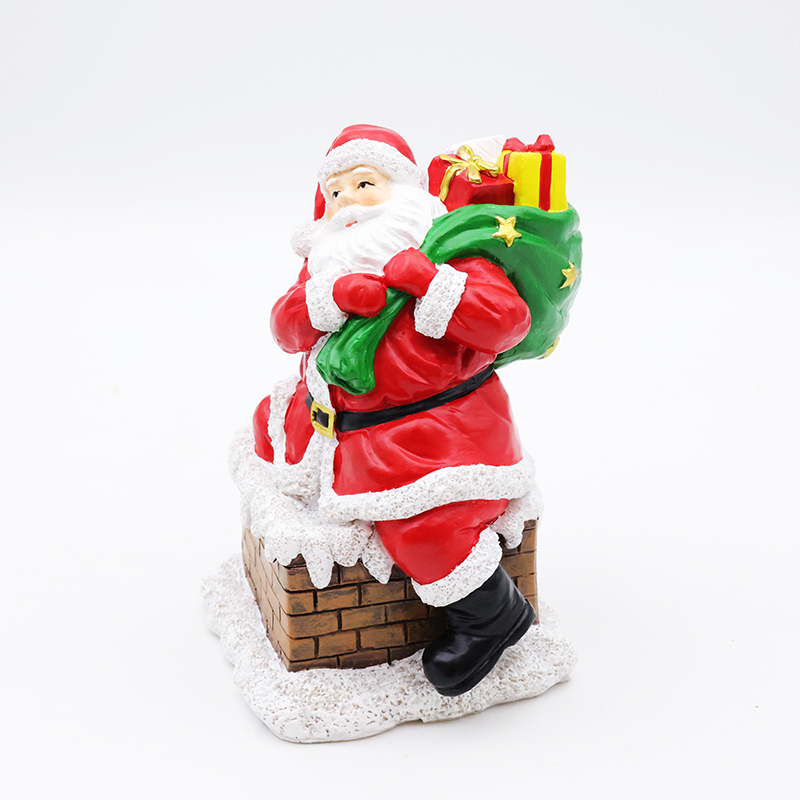 Custom new Christmas decor resin miniature Santa Claus going down chimney figurine ornaments tabletop sculpture supplier